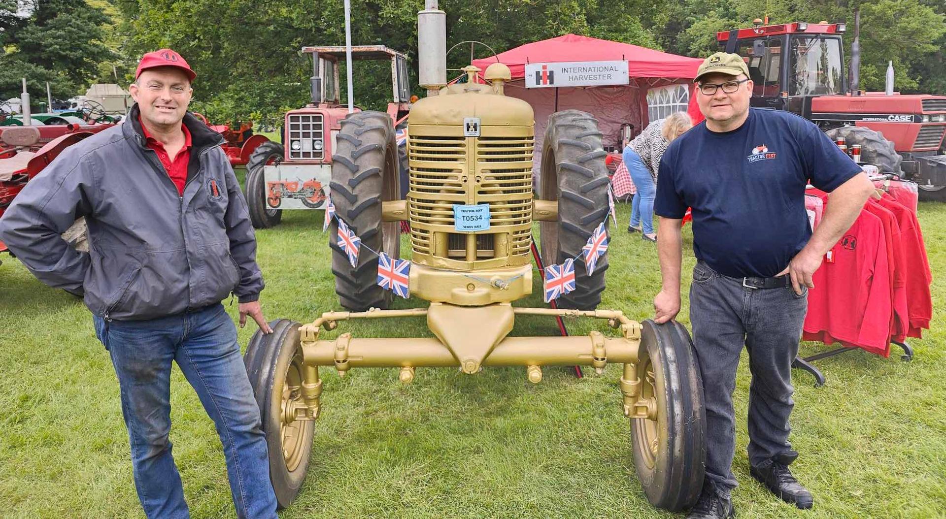 Ian Muir and tractor fest organiser Kevin Watson with a golden painted Queens coronation tractor. 