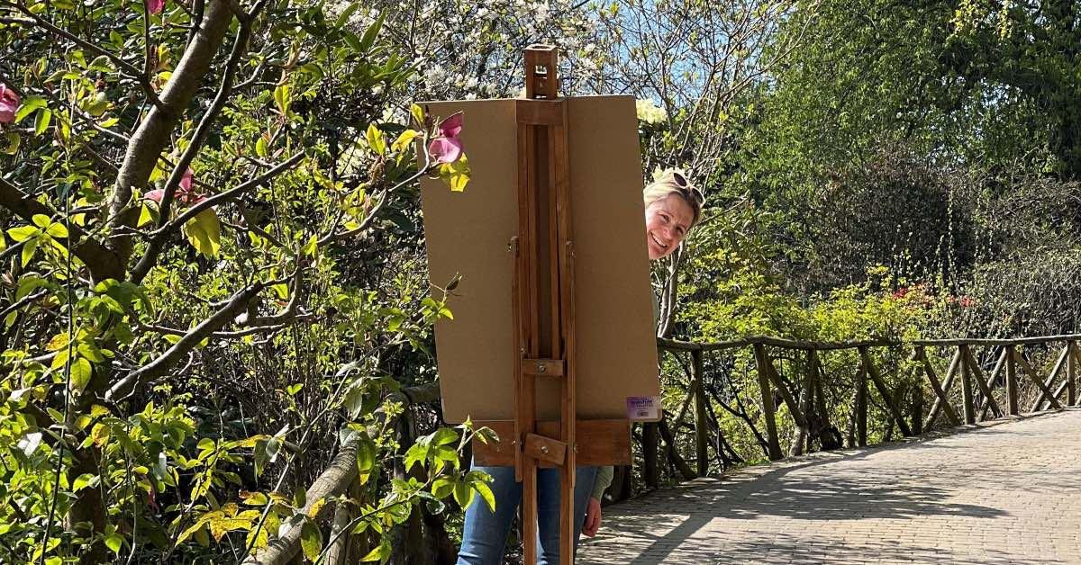 Sophie pictured painting in the gardens.