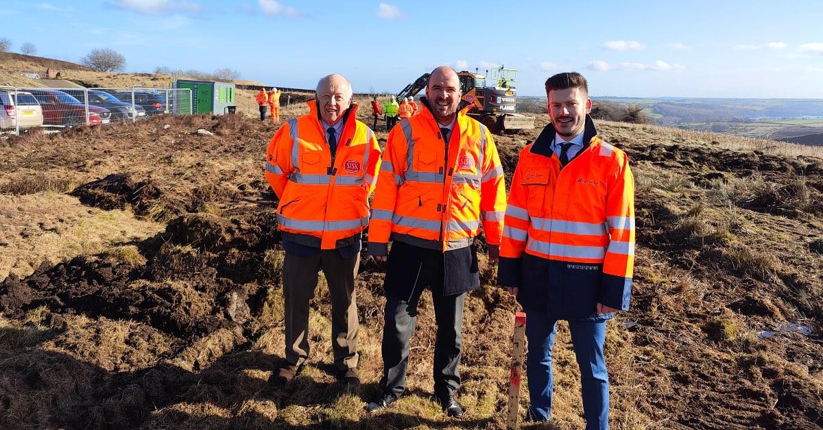 (Left to right) Cllr Carl Les, leader of county council, Richard Holden, minister for roads, and Cllr Keane Duncan, executive councillor for highways.