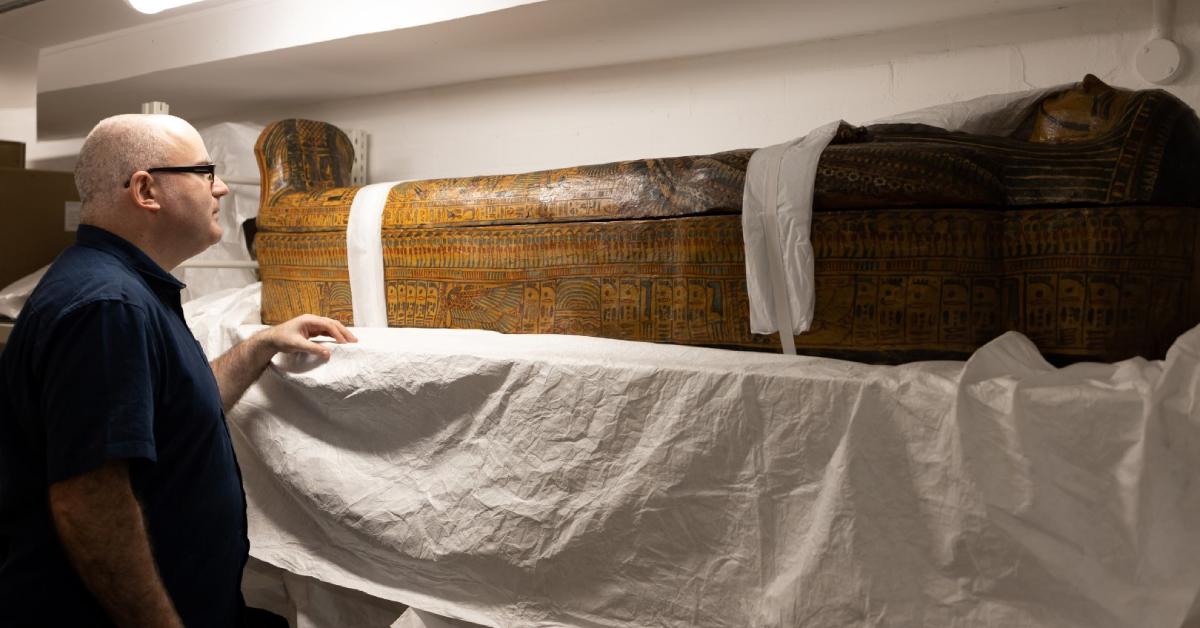 Ken Griffin of Swansea University's Egypt Centre looking at a spectacular coffin from the Third Intermediate Period (c. 1000-700 BC).