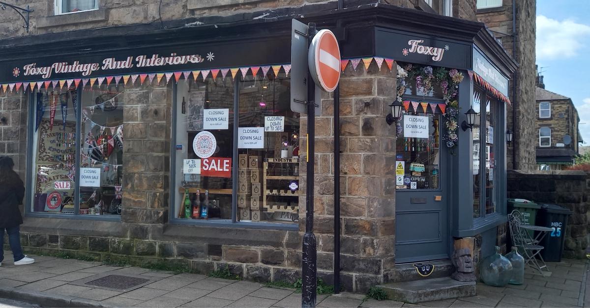 Photo of the exterior of Foxy Vintage &amp; Interiors in Harrogate, with 'Closing Down Sale' signs in the window.