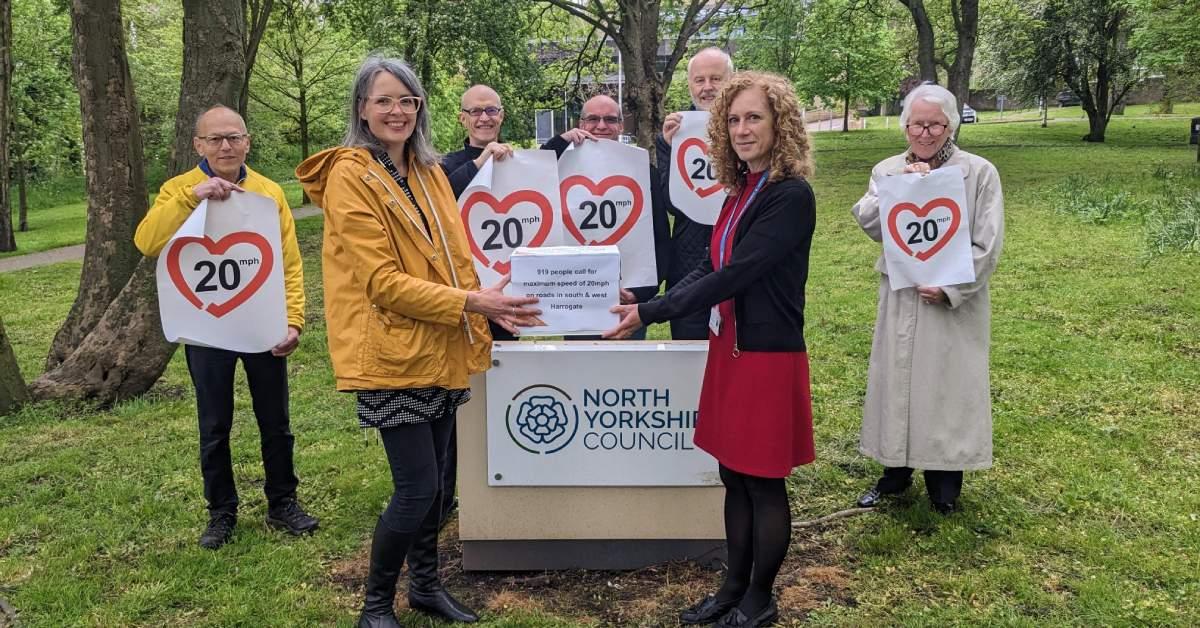 Hazel Peacock hands the road safety petition to Elizabeth Jackson of North Yorkshire Council