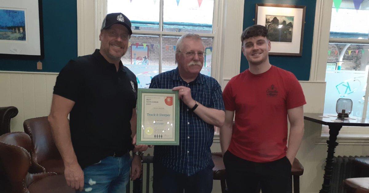 'Track and Sleeper' owners receiving the award for best newcomer off local CAMRA chairman.