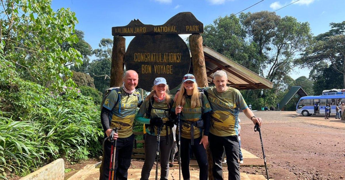 Samantha Harrison with her team climbing Mount Kilimanjaro.