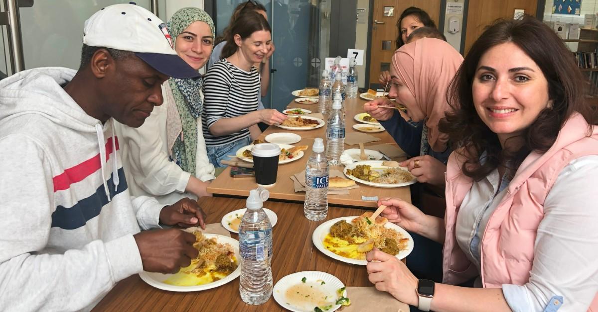 Photo of diners at an Afghan lunch cooked by Nahid for the Refugee Council earlier this year.