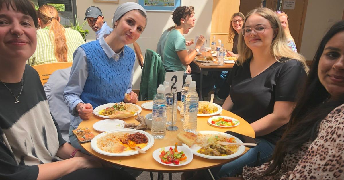 Photo of diners at an Afghan lunch cooked by Nahid for the Refugee Council.