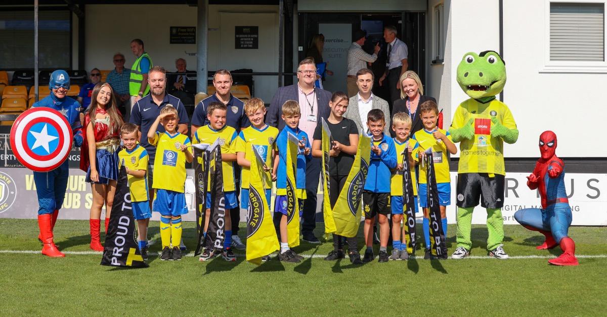 Harrogate Town junior supporters club with Homes Together officials.