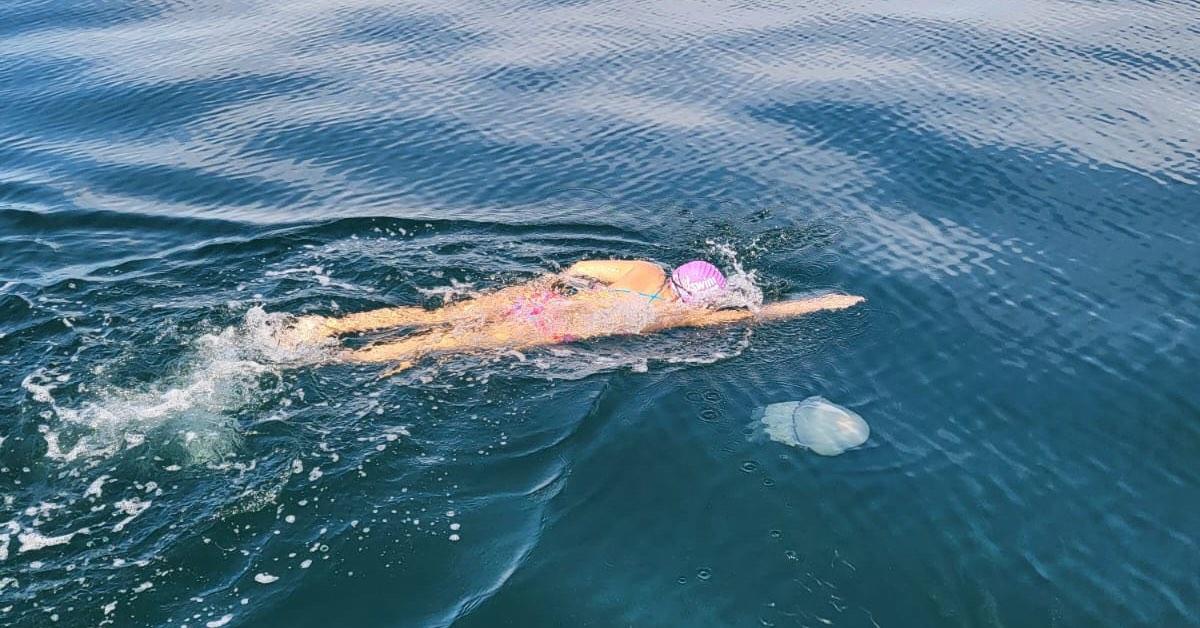 Millie swimming from Jersey to France as part of her English Channel training.