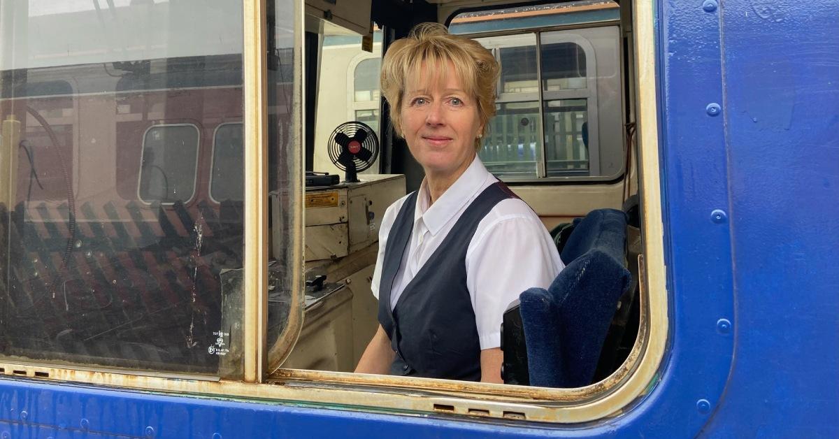 Photo of Harrogate woman Sue Threadgold, Wensleydale Railway's first female train driver, at the controls of a diesel Pacer train.