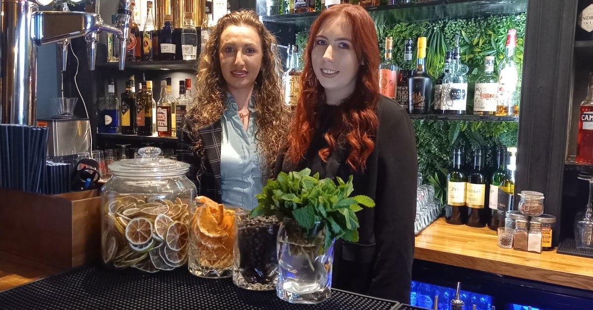 Photo of proprietor Flavia Milovi and manager Natasha Murray behind the bar at Locus Bar in Harrogate.