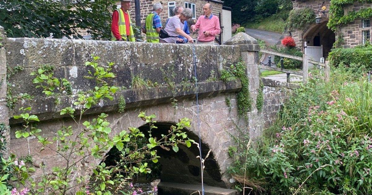 Photo of volunteers from Nidd Action Group sampling water quality in Oak Beck.