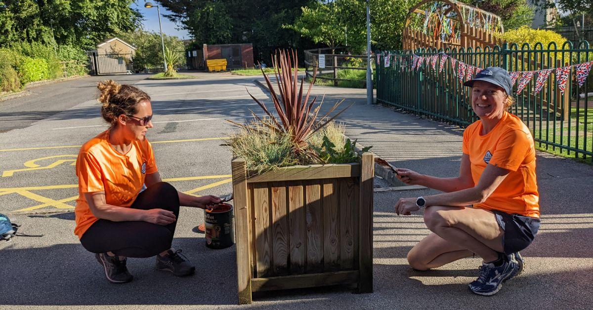 Photos of volunteers Hannah and Lizzie painting a planter at Saltergate School in Harrogate.