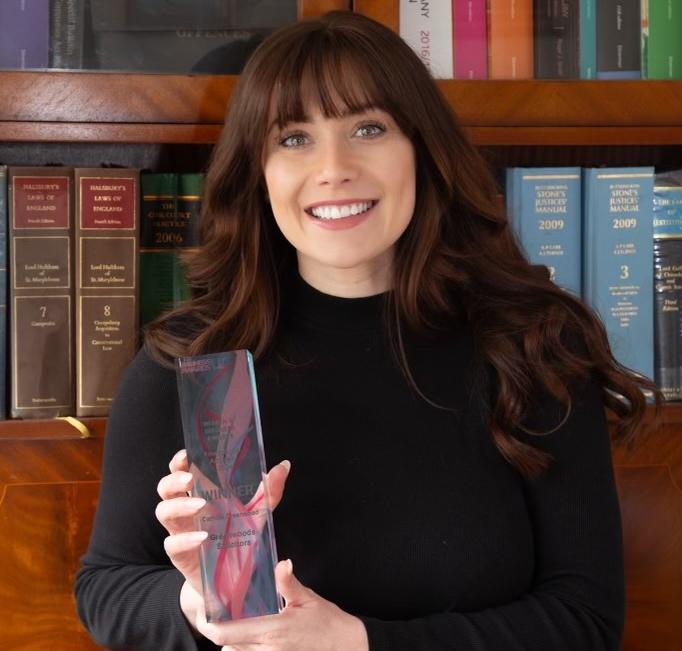 Photo of Camilla Greenwood of Knaresborough law firm Greenwoods Solicitors, holding the Triumph Over Adversity award she was presented with at the Women in Business Awards 2024.