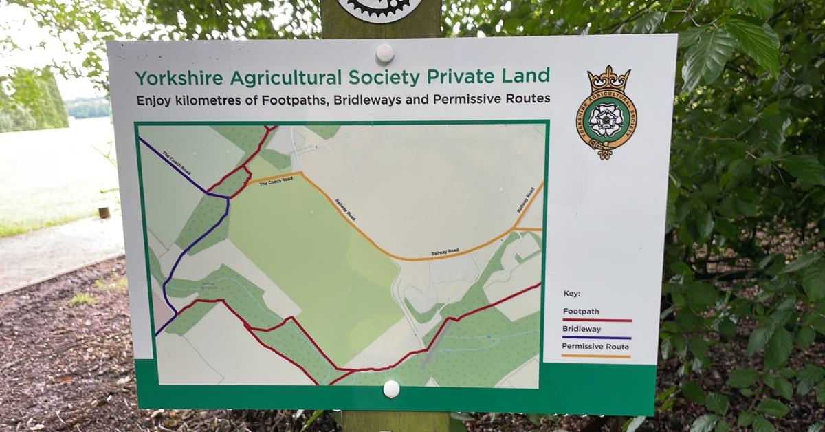 Photo of a sign put up by the landowner, the Yorkshire Agricultural Society, telling the public where they may still walk.