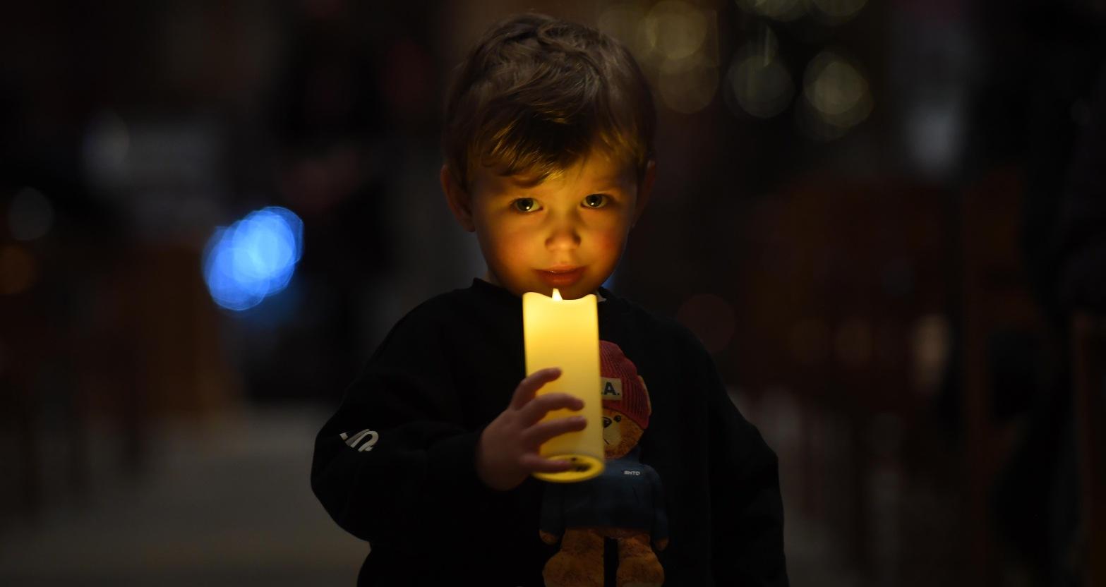 2-year-old-dylon-chatterton-watching-the-concert-under-candle-light-picture-gerard-binks