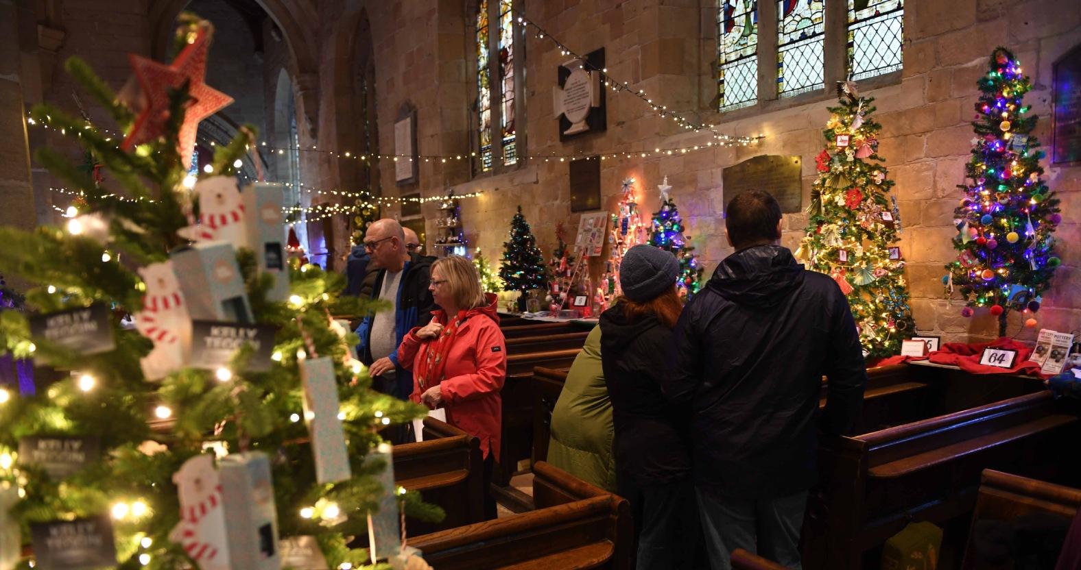 christmas-tree-festival-st-johns-church-knaresborough-pictured-visitors-view-the-christmas-trees-picture-gerard-binks