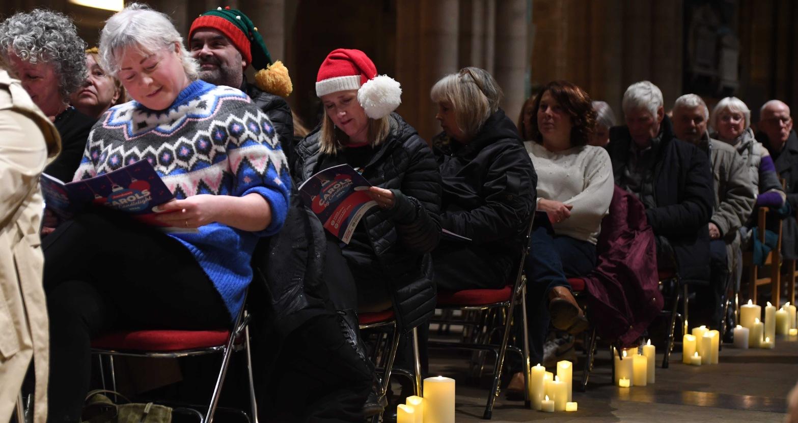 henshaws-carols-by-candlelight-concert-at-ripon-cathedral-pictured-guests-sing-by-candle-light-picture-gerard-binks
