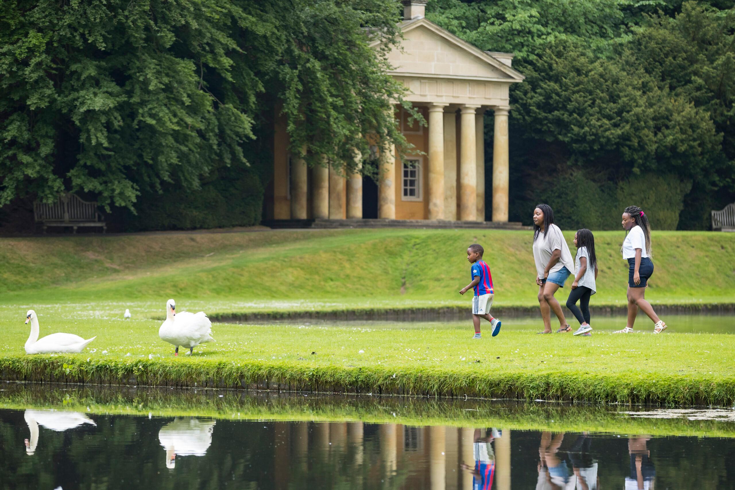 family-exploring-fountains-abbey-and-studley-royal-water-garden-yorkshire