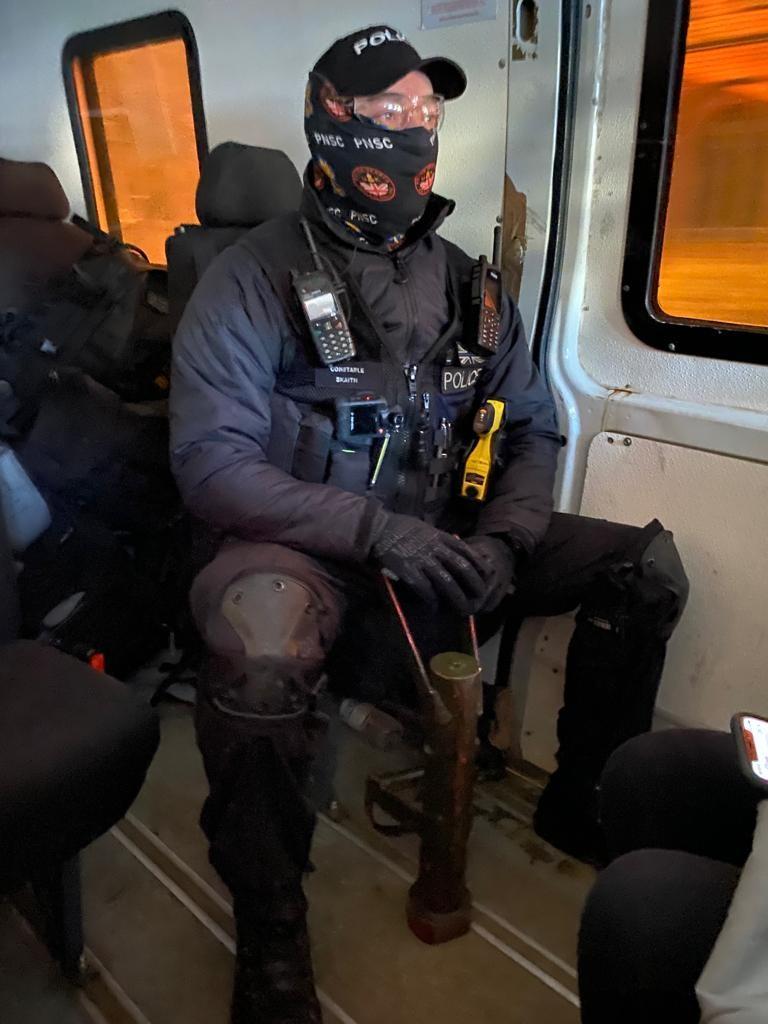 A police officer ready to conduct a warrant