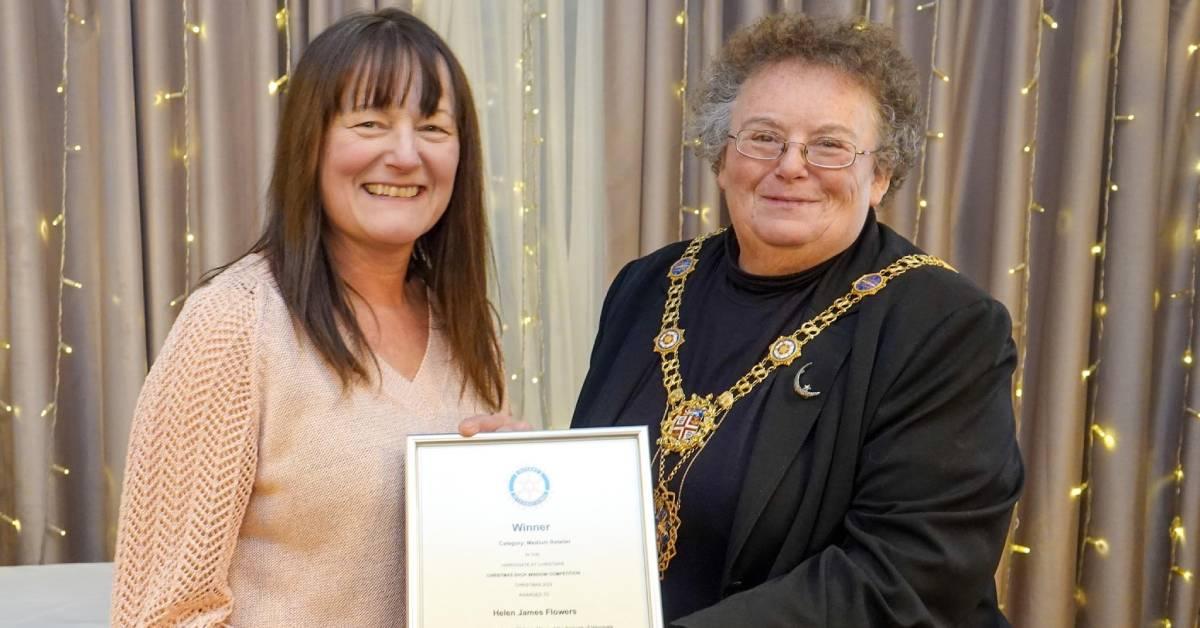 Helen James Flowers accepting her award for medium retailer