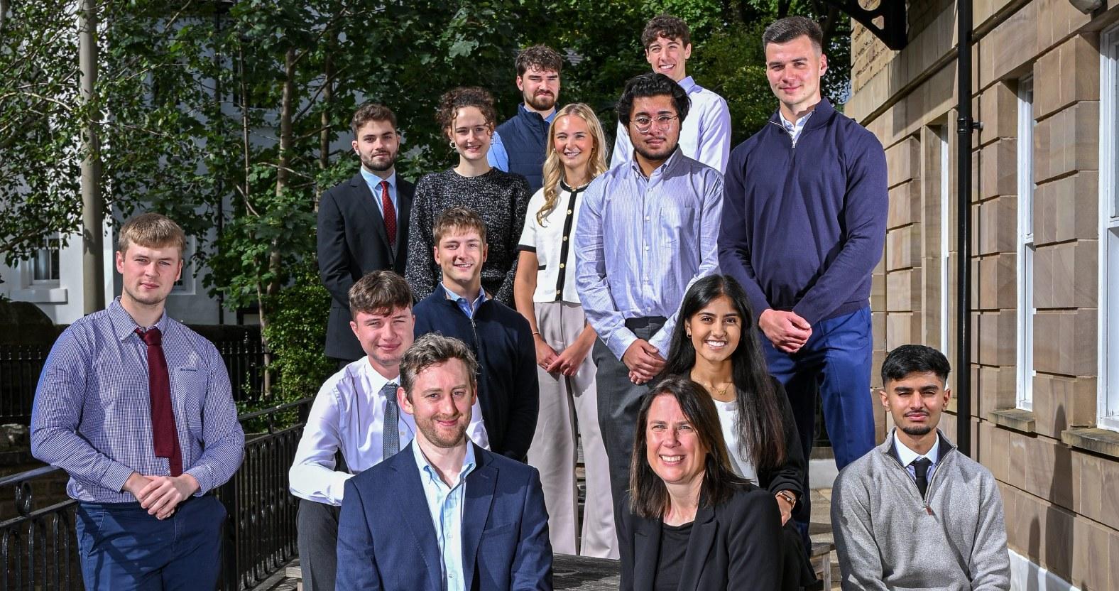 fergus-watson-west-and-michelle-rapson-from-saffery-with-the-12-new-trainees1