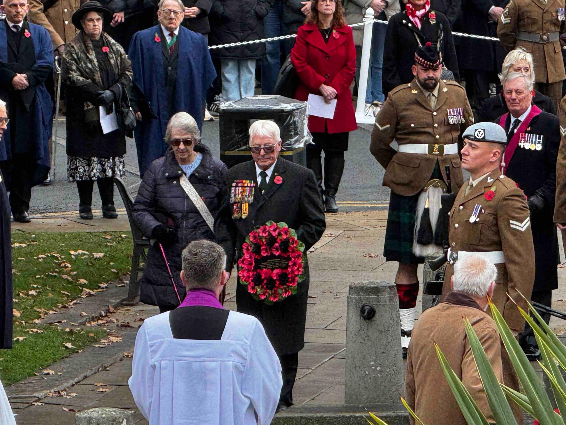 couple-laying-wreath