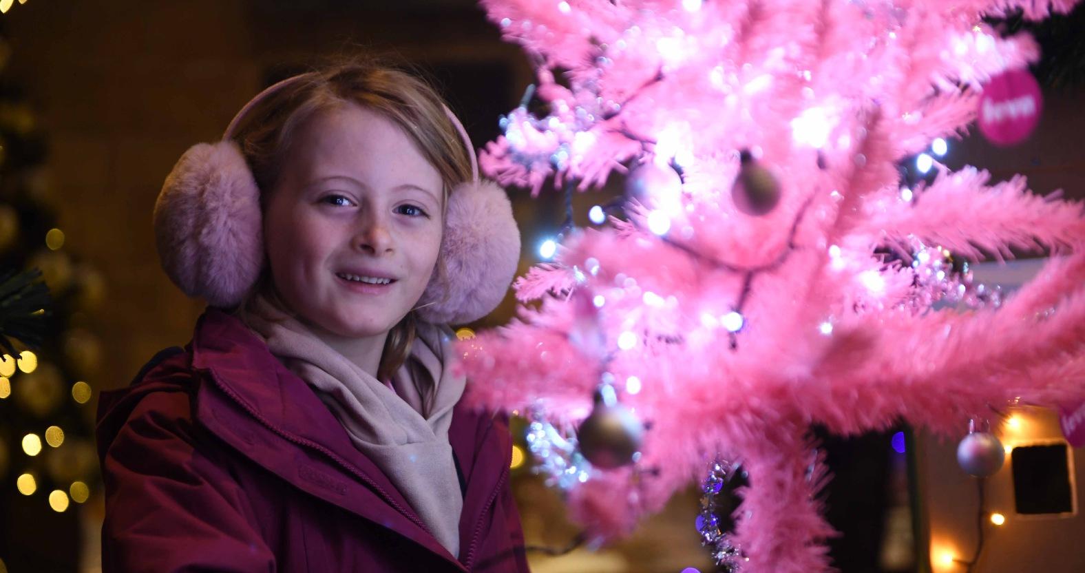 christmas-tree-festival-st-johns-church-knaresborough-pictured-8-year-old-freya-mcnab-views-the-tiny-pink-christmas-tree-picture-gerard-binks