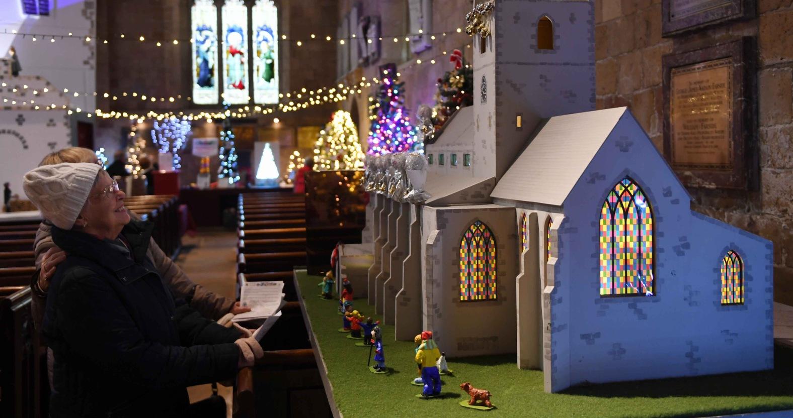christmas-tree-festival-st-johns-church-knaresborough-pictured-visitors-view-the-exhibits-on-diplay-picture-gerard-binks