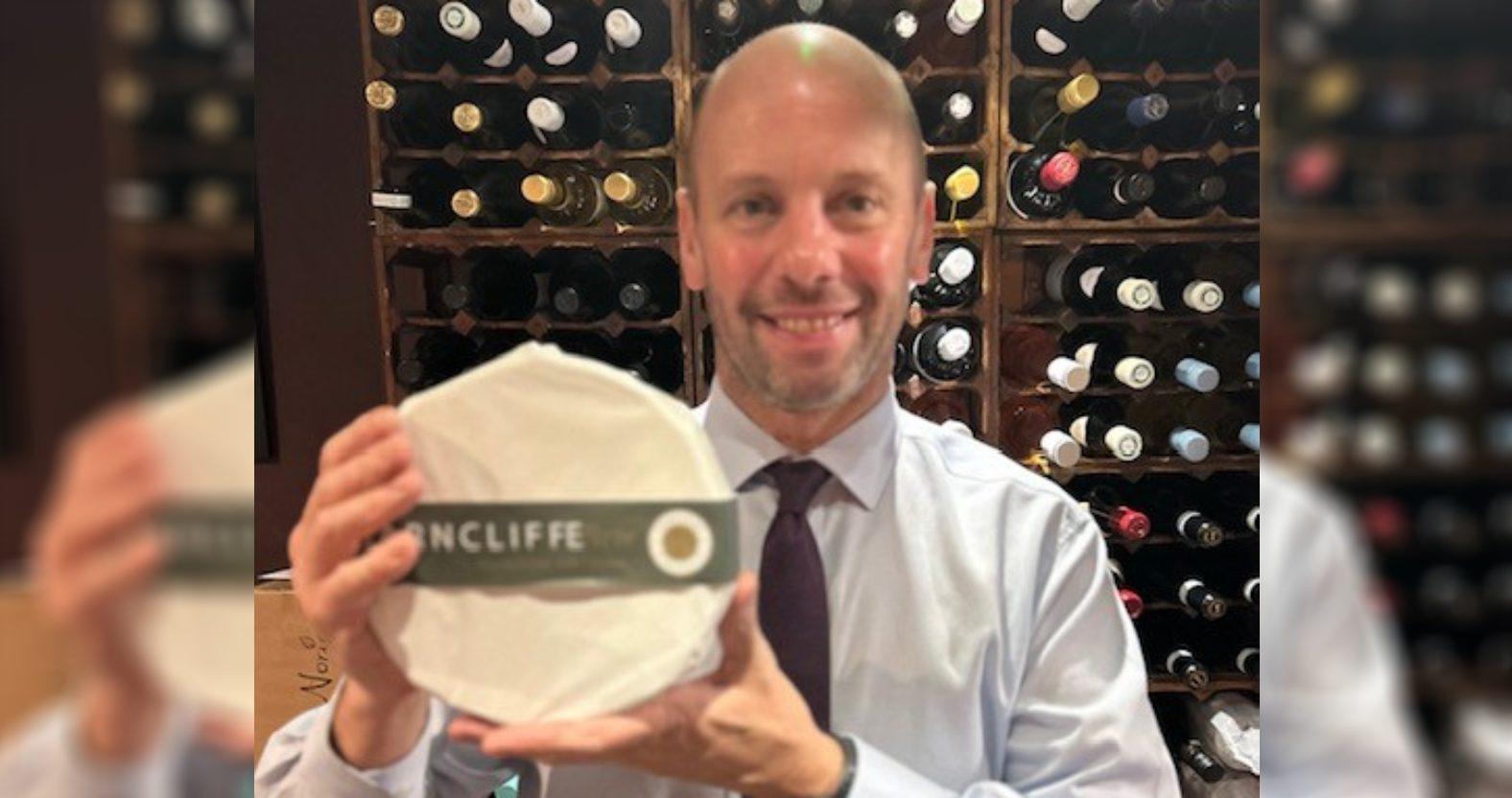 david-straker-with-a-wheel-of-brie