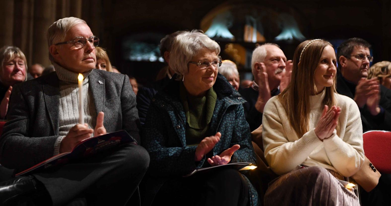 henshaws-carols-by-candlelight-concert-at-ripon-cathedral-pictured-guests-applaud-the-singing-on-stage-picture-gerard-binks