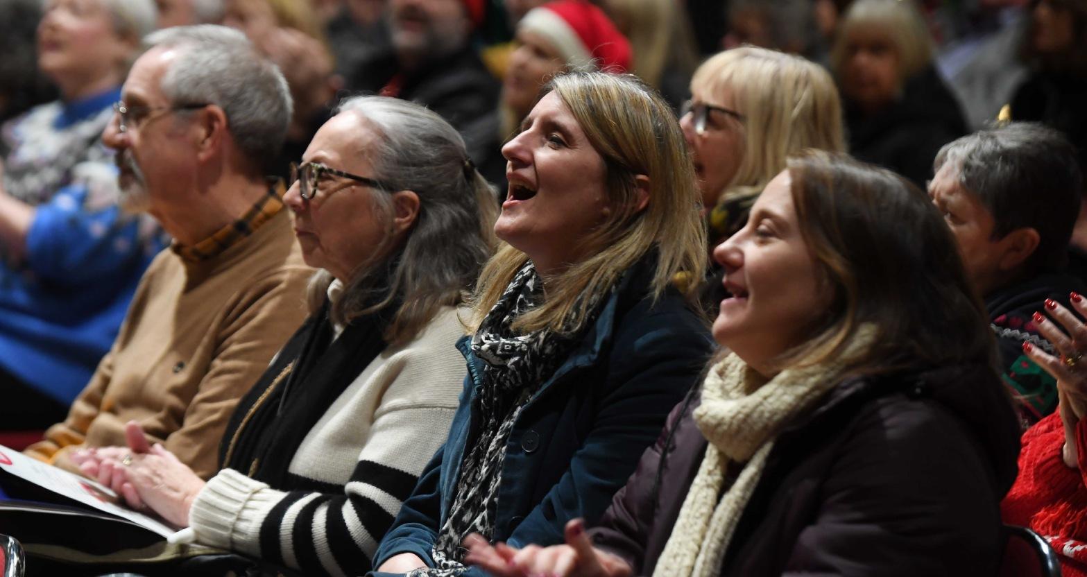 henshaws-carols-by-candlelight-concert-at-ripon-cathedral-pictured-guests-sing-along-with-the-carols-picture-gerard-binks