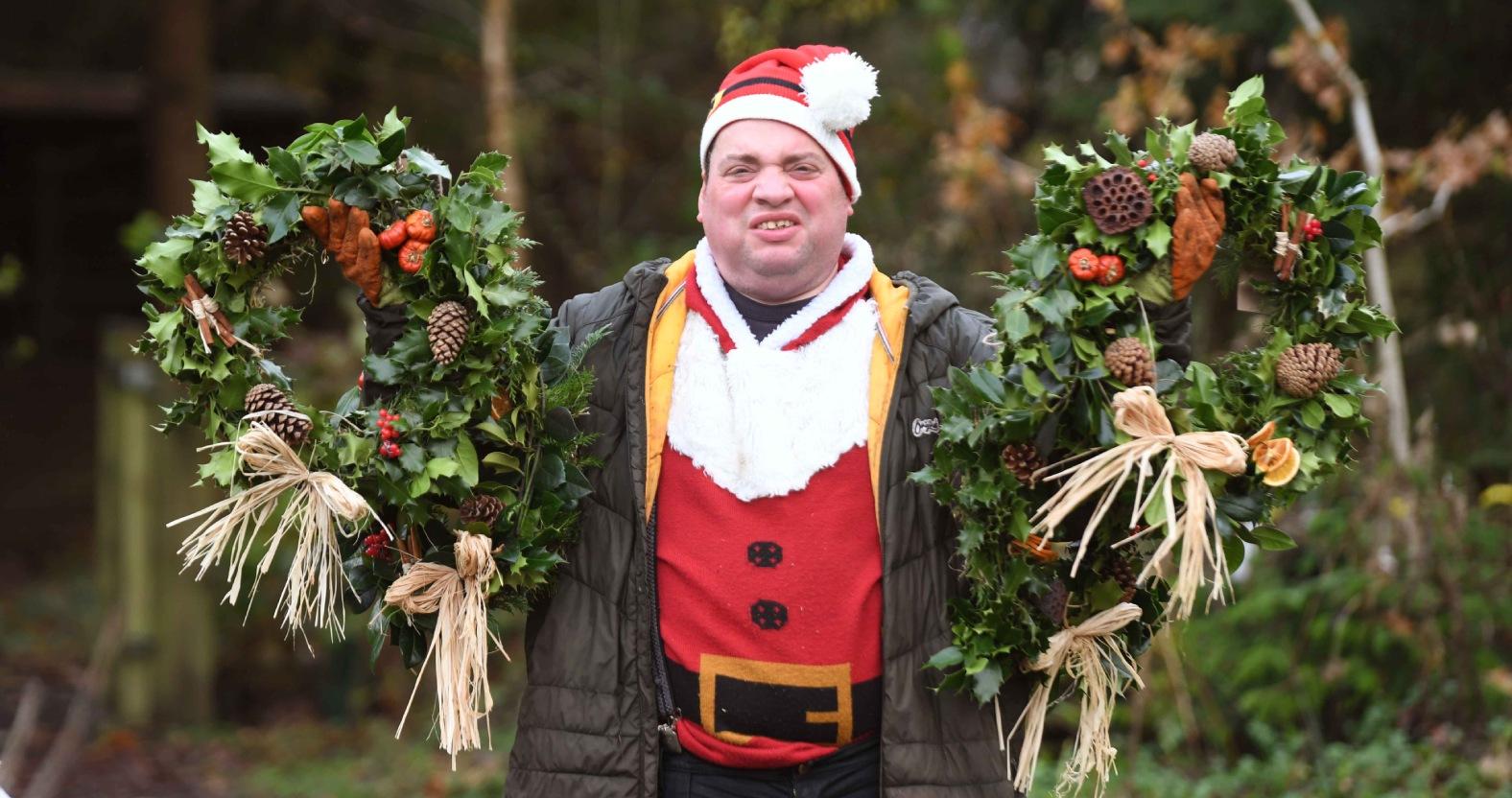 horticap-student-carl-elliott-with-handmade-christmas-wreaths-for-sale