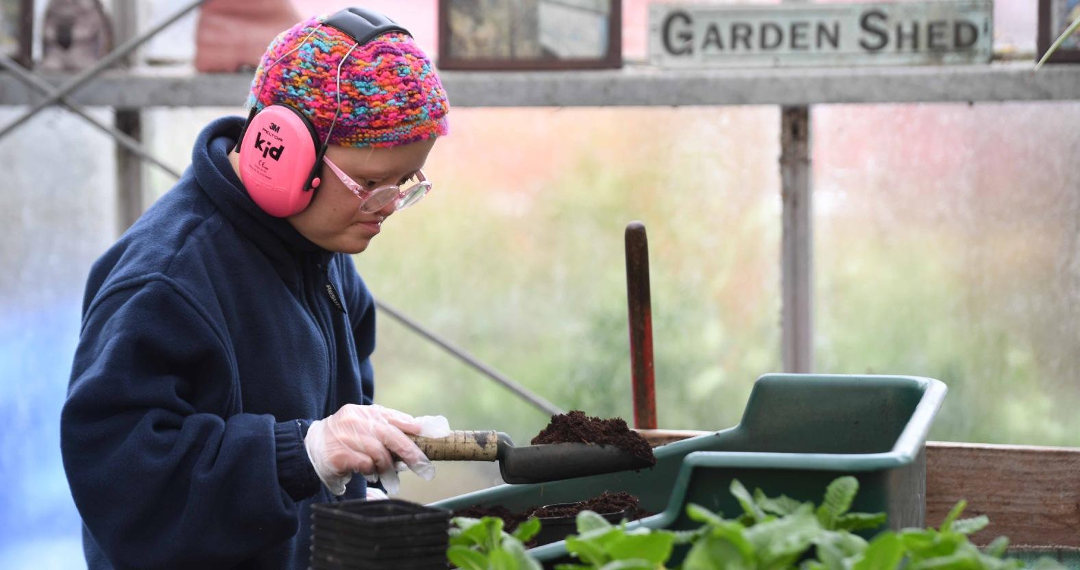 horticap-student-philippa-holland-potting-plants-for-christmas