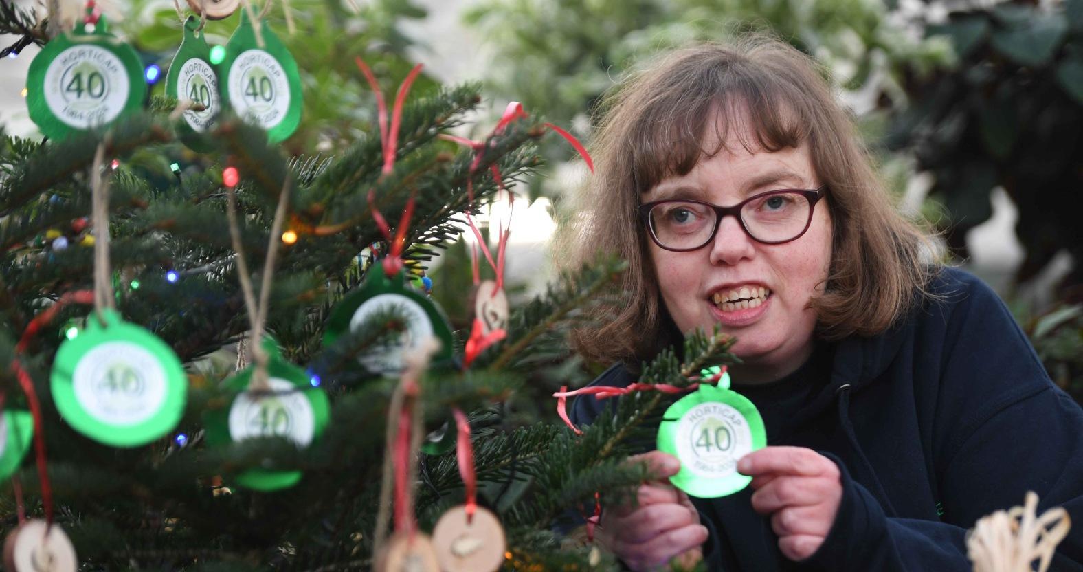 horticap-student-victoria-taylor-hanging-decorations-on-the-horticap-christmas-tree
