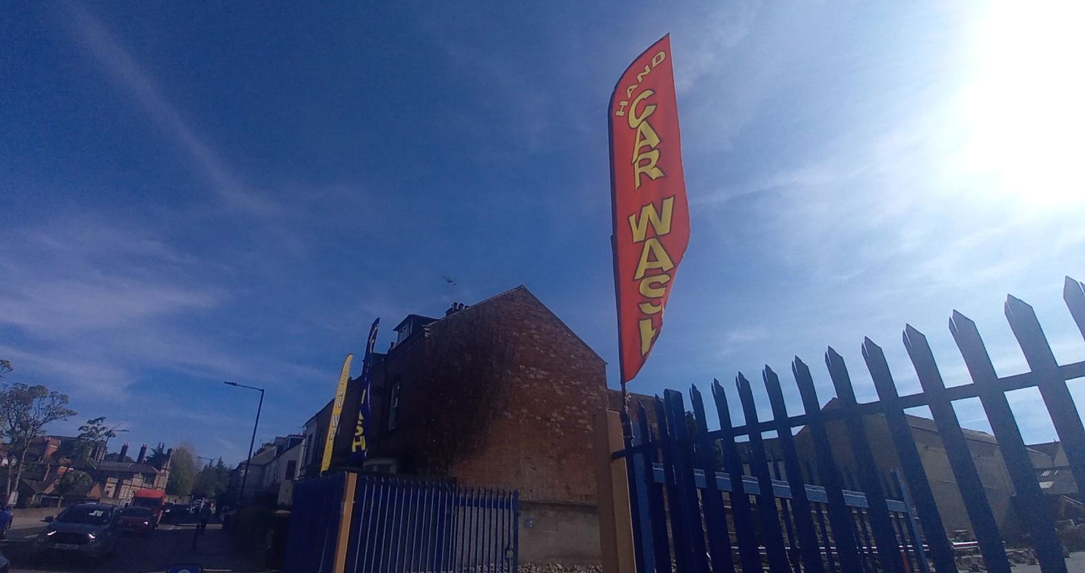skiptonrdcarwash-flags