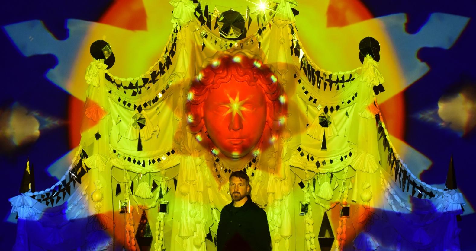 ed-kluz-stand-in-front-of-his-installation-between-chaos-and-light-at-fountains-hall-2-1