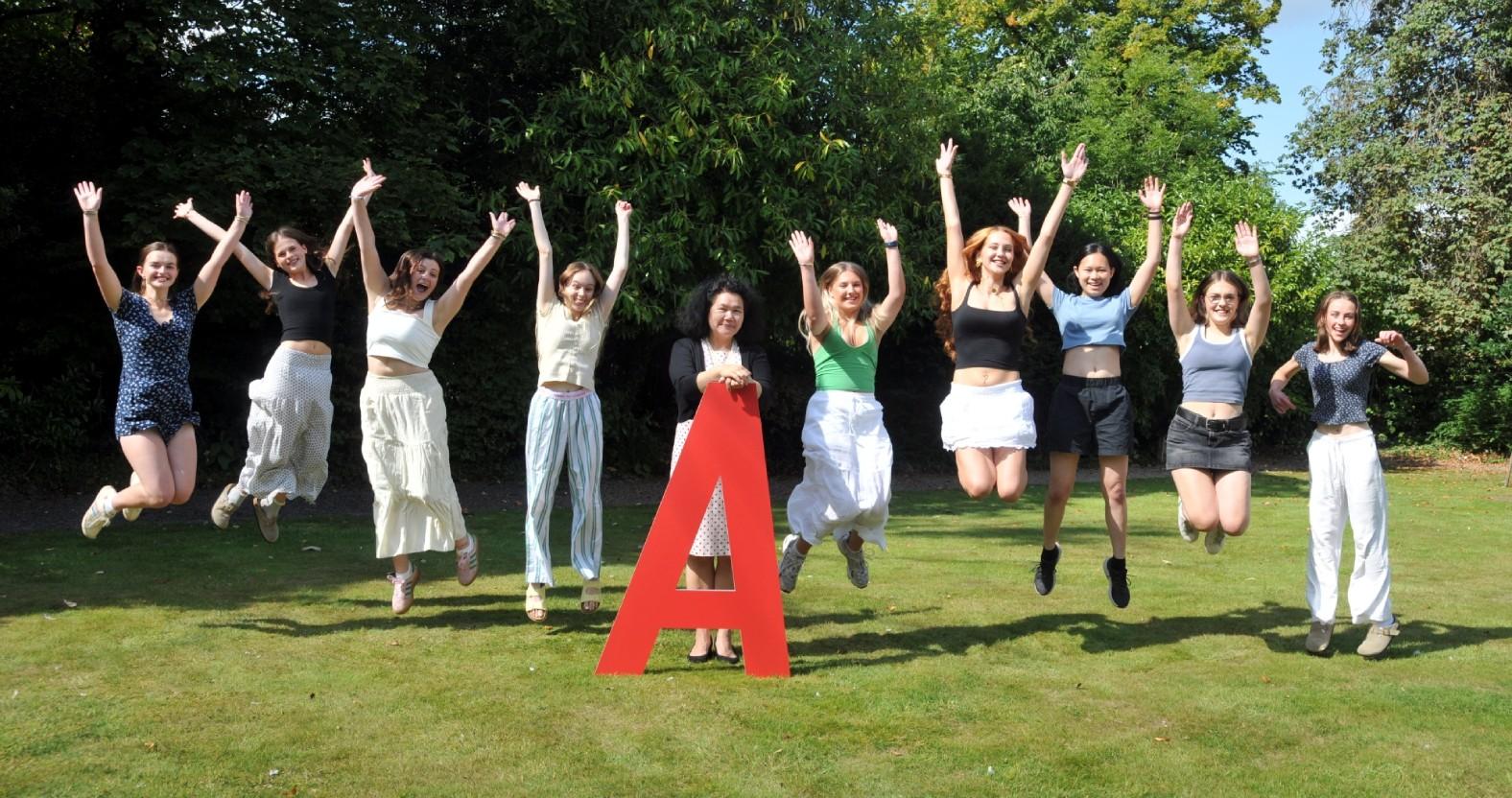 photo-5-harrogate-ladies-college-pupils-jumping-for-joy-with-principal-joanna-fox-celebrating-their-best-a-level-results-in-over-five-years