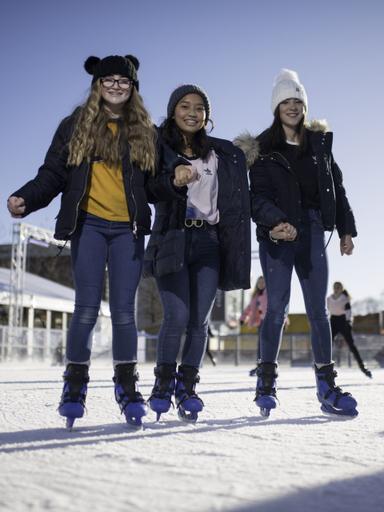 three-girls-skating-at-yorkshires-winter-wonderland-portrait-jpg
