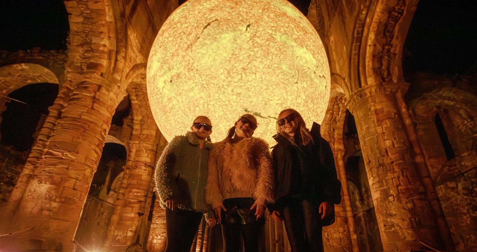 daisy-shepherd-11-millie-mcdaid-12-and-emily-parker-welsh-11-from-harrogate-catch-some-rays-from-helios-at-fountains-abbey-credit-j-shepherd-1