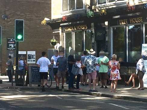 People outside the Coach and Horses back in May.