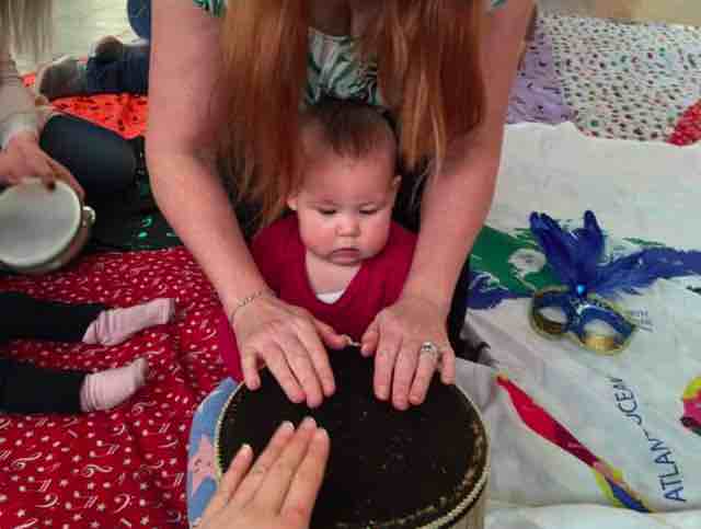 baby playing a drum