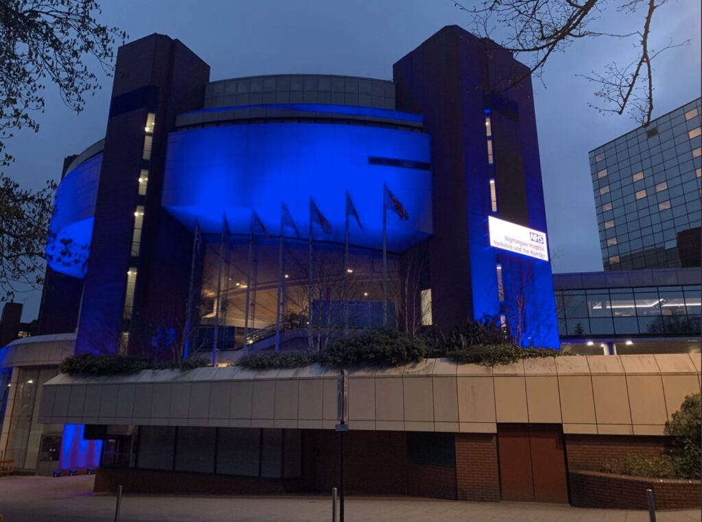 Harrogate convention centre lit up blue.