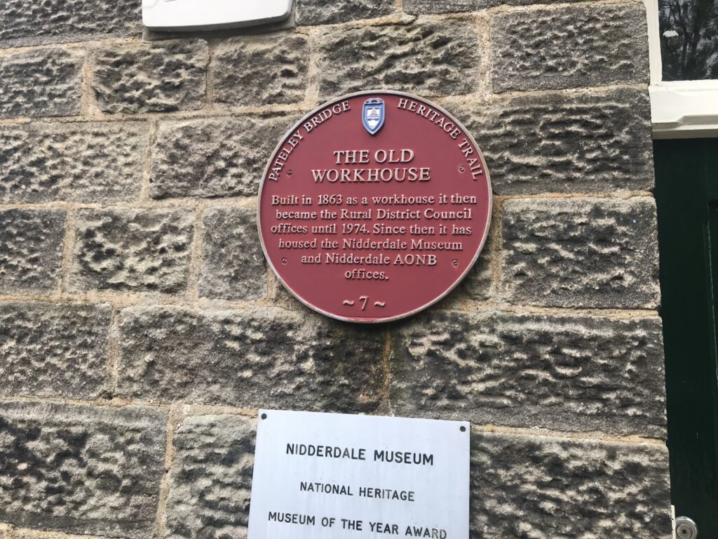 Photograph of plaque on wall at Nidderdale Museum