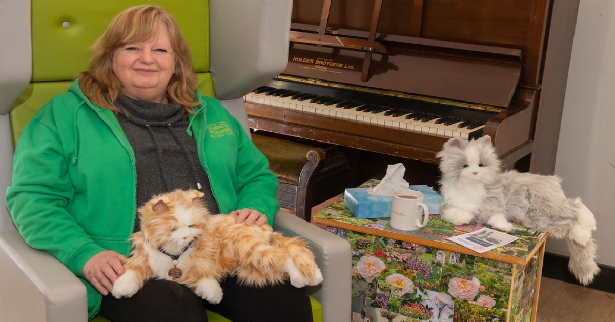 Jill Quinn, CEO of Dementia Forward with the robotic cats