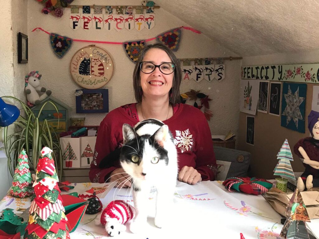 Felicity Jennings in her home studio, with one of her cats