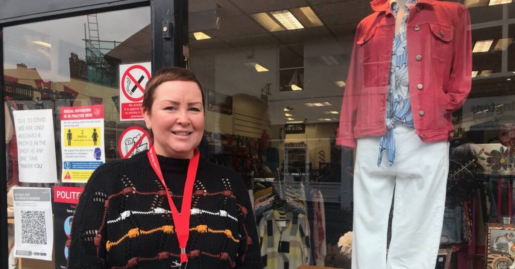 Photo of Victoria Smith outside the Salvation Army charity shop