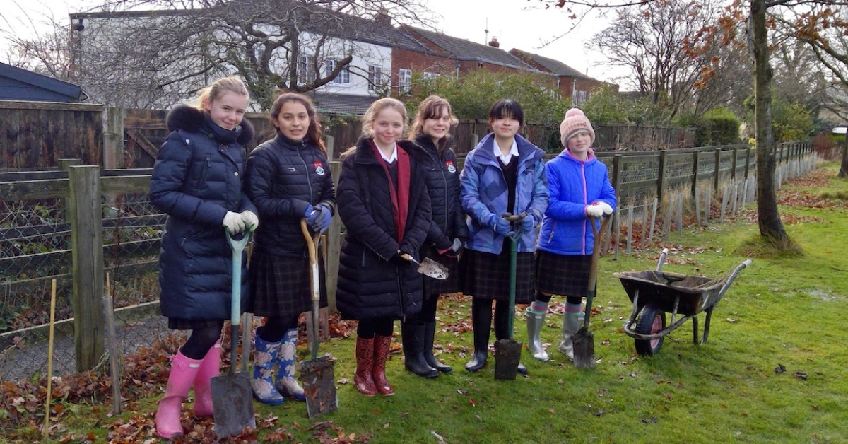 Members of Ashville College's Green Committee, which has planted the trees on campus.