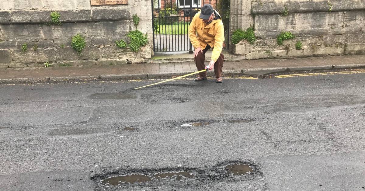 Ripon resident Stewart Readman measuring potholes