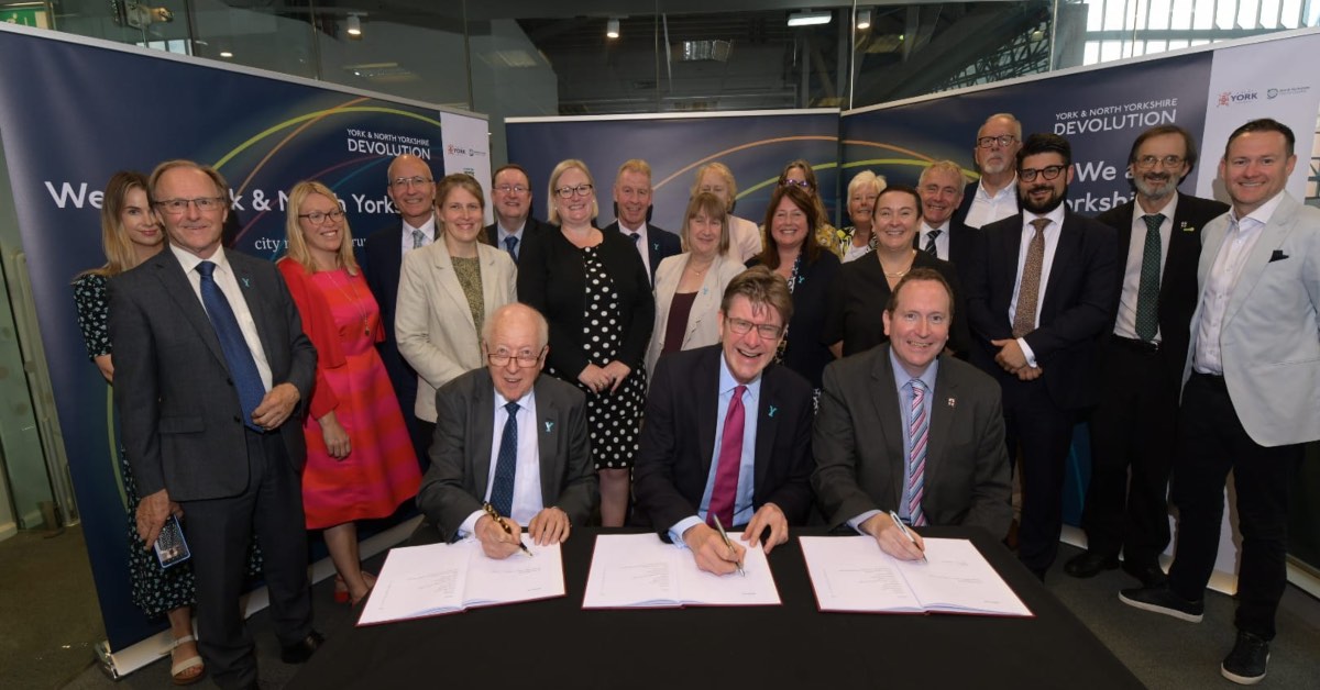 Pictured: Cllr Carl Les, leader of North Yorkshire County Council, Greg Clark MP and Cllr Keith Aspden, leader of City of York Council sign the document.