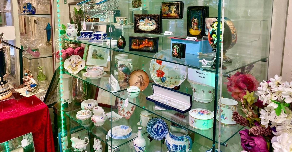 Photo of porcelain items in a glass cabinet at Antiques on High in Harrogate.